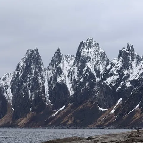 The jagged peaks of Senja above the sea
