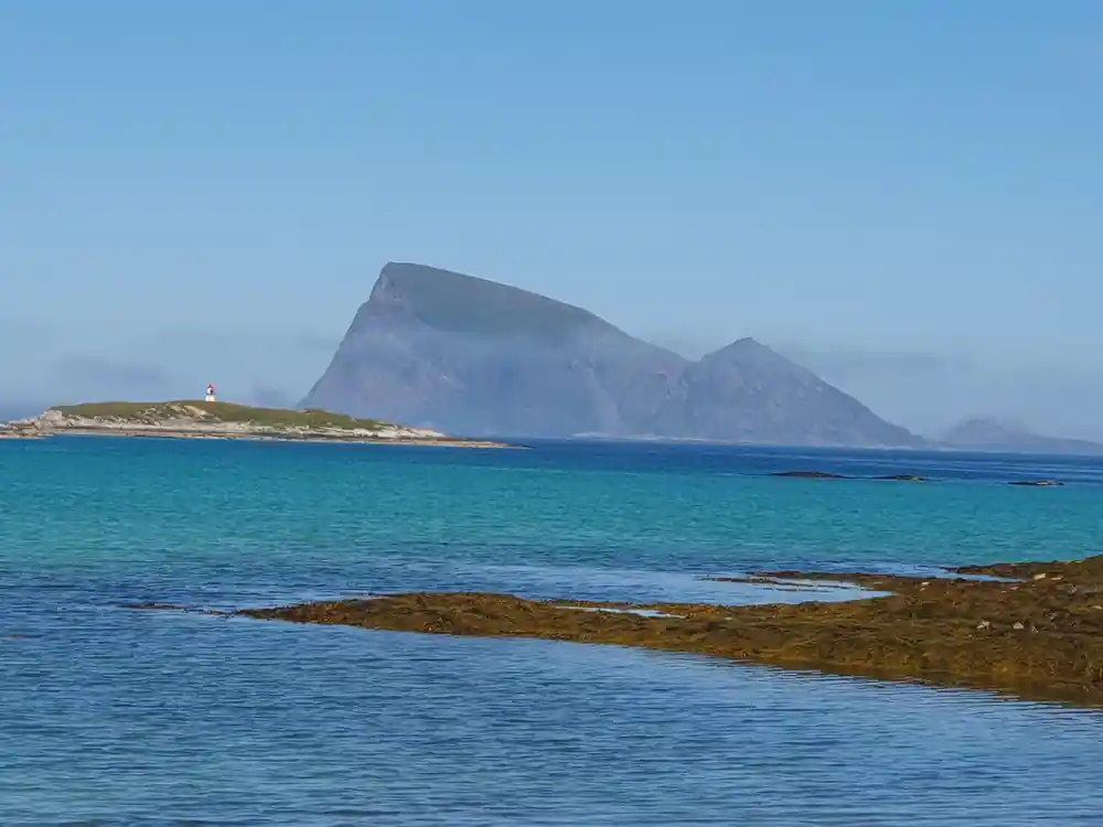 A distinctive flat-topped island across turquoise water
