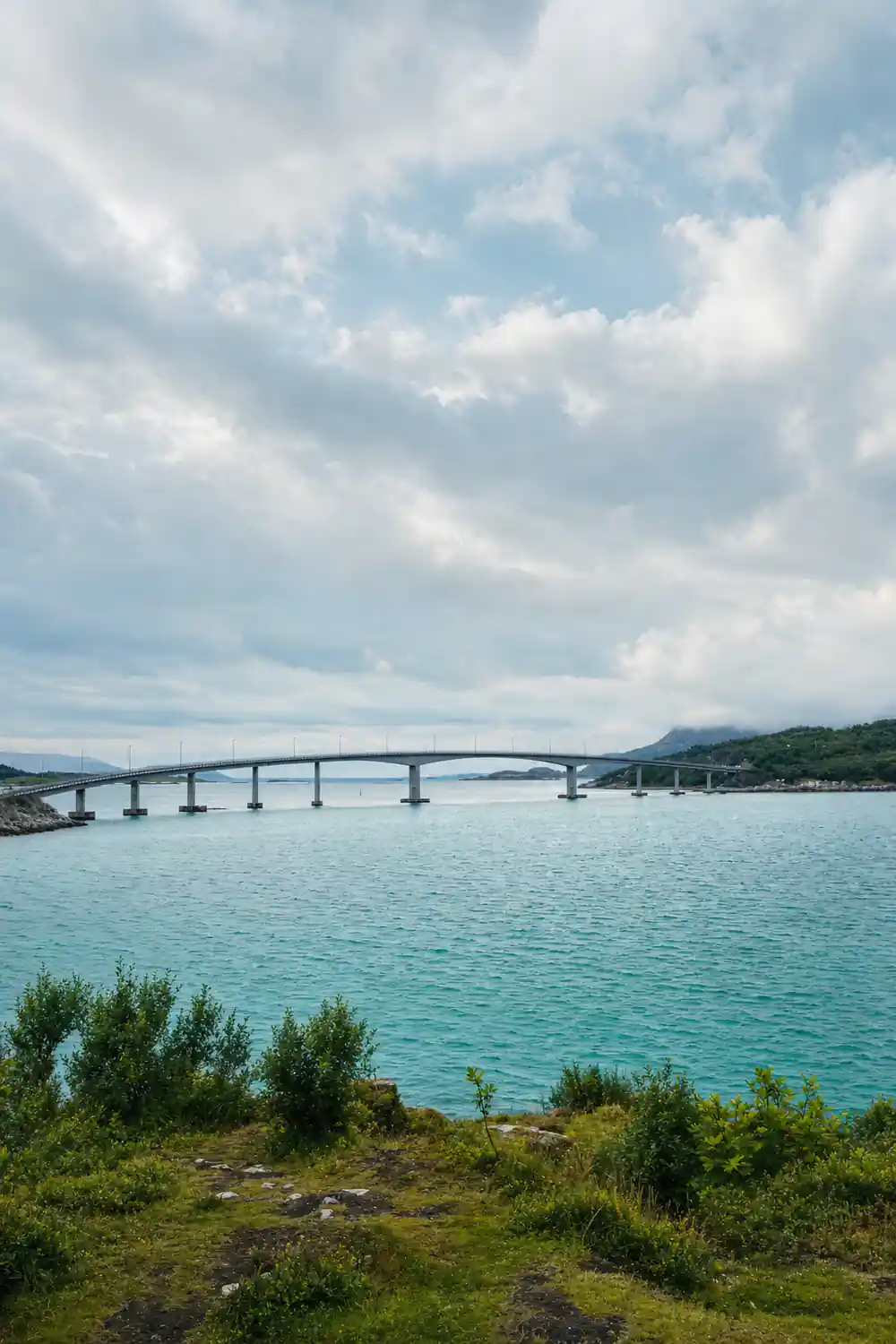A long low bridge crossing pale turquoise water